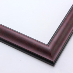 This reverse scoop frame with bevelled inner lip features a mahogany wash. The thin veneer maintains the natural wood grain texture across the short edge.  Both the outer drop edge and inner lip are matte black.

1.375 " width: ideal for small images. This simple, elegant frame flatters photographs, watercolour or oil paintings, and giclee prints alike.